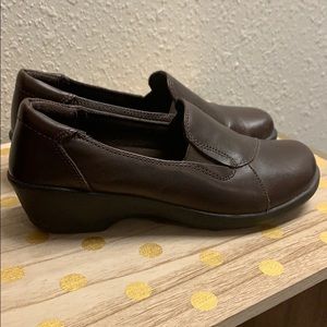 Brown Clarks collection flats